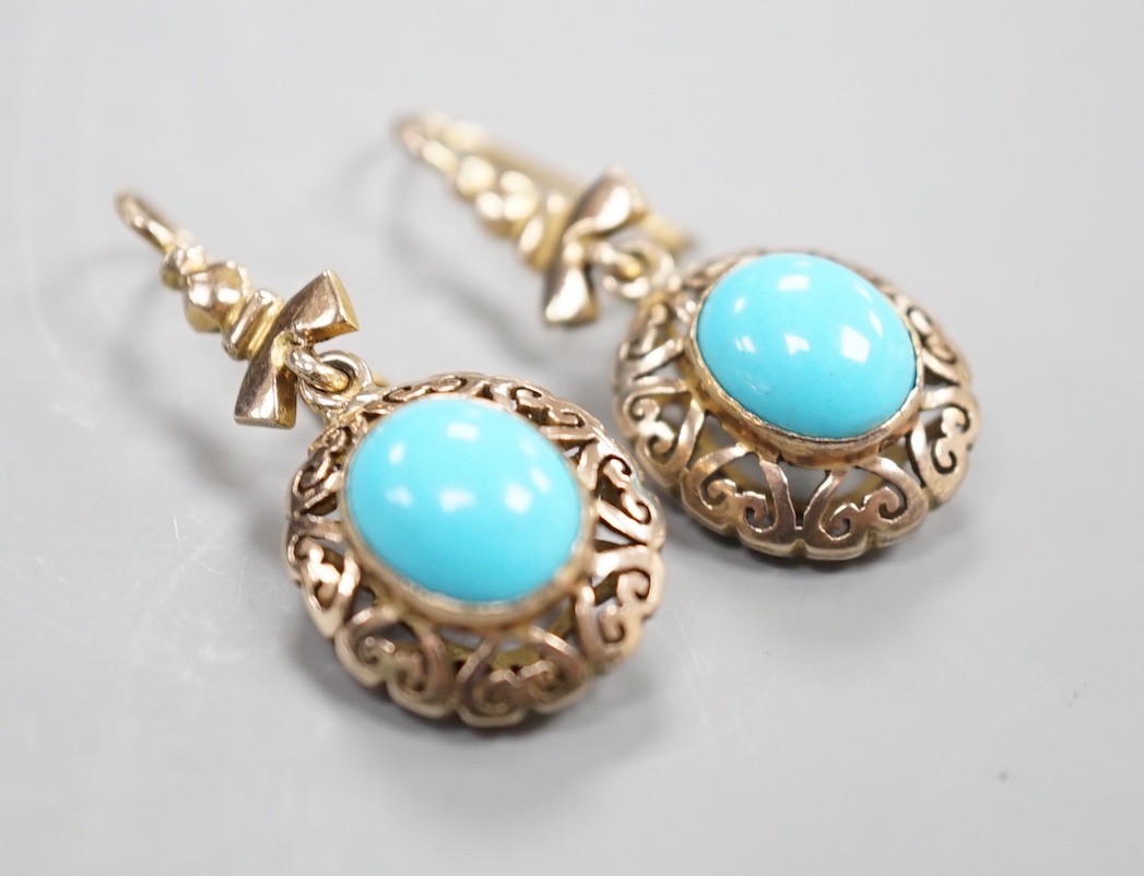 A pair of early 20th century pierced yellow metal and turquoise set drop earrings, 35mm, gross weight 4.3 grams.